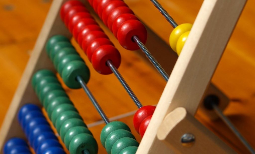 An abacus, an ancient counting device with rows of beads used for performing arithmetic calculations, one of the best approaches mastering numbers.